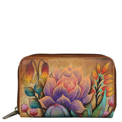 Anuschka style 1125, handpainted Twin Zip Organizer Wallet. Desert Sunset painted in Tan color. Featuring inside eighteen credit card holders, one bill pocket, one ID window, five multipurpose slip in pockets and one zippered pocket.