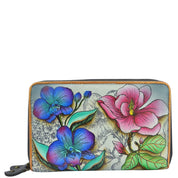 Anuschka style 1125, handpainted Twin Zip Organizer Wallet. Floral Fantasy painted in Grey color. Featuring inside eighteen credit card holders, one bill pocket, one ID window, five multipurpose slip in pockets and one zippered pocket.