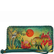 Anuschka Style 1134, handpainted Zip Around Wristlet with Removable Strap. Rousseau's Jungle painting