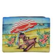 Anna by Anuschka style 1854, handpainted Two Fold Clutch Wallet. Life is a Beach painting in multi color. Featuring eleven credit card holder, one ID window.