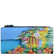 Anna by Anuschka style 1869, handpainted Two Fold Clutch Wallet. Amalfi Dawn painting in blue color. Featuring twelve credit card holders and one id window.