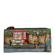 Anna by Anuschka style 1869, handpainted Two Fold Clutch Wallet. Le Café painting in multi color. Featuring twelve credit card holders and one id window.