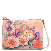 Anna by Anuschka style 8073, handpainted East West Bag. Vintage Garden painting in pink/peach color. Featuring full length pocket with magnetic closure, Fits tablet, Fits E-Reader, Fits phone.
