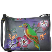 Anna by Anuschka style 8073, handpainted East West Bag. Bird on a Branch Grey painting in grey color. Featuring full length pocket with magnetic closure, Fits tablet, Fits E-Reader, Fits phone.