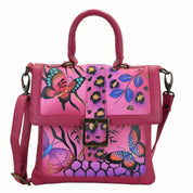 Anna by Anuschka style 8074, handpainted Flap Saddle Bag. Animal Butterfly Pink painting in pink/peach color. Featuring two open compartment and one full length wall pocket under flap, Turn Lock, Fits tablet, Fits E-Reader, Removable strap.