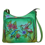 Anna by Anuschka style 8178, handpainted Large Organizer. Birds in Paradise Green painting in green/mint color. Featuring one all around zippered organizer with two open pockets, four credit card holder, one ID window, and a cell pocket, Built-in organizer, Fits tablet, Fits E-Reader.