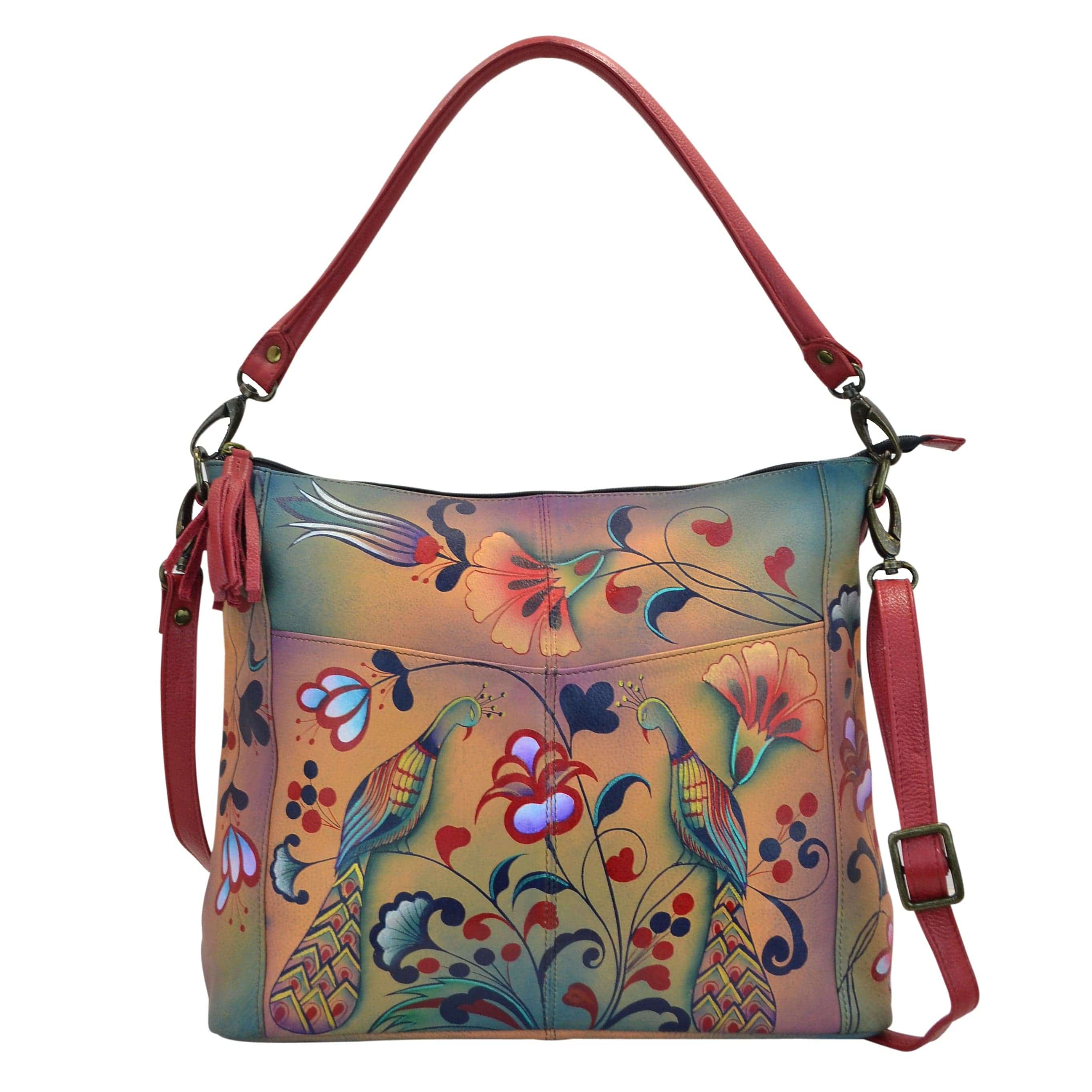 Anna by Anuschka style 8188, handpainted Convertible Shoulder Bag. Turkish Pottery painting in multi color. Featuring inside one zippered wall pocket, one open wall pocket, two multipurpose pockets, Fits tablet, Fits E-Reader, Fits Laptop, Removable strap.