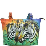 Anna by Anuschka style 8229, handpainted Large Tote. Zebra Safari painting in multi color. Featuring inside one zippered compartment, one zippered wall pocket, one open pockets, two multipurpose pockets, Fits tablet, Fits Laptop.