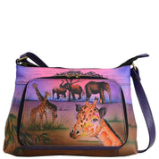 Anna by Anuschka style 8238, handpainted Crossbody Organizer. Serengeti Sunset painting in pink/peach color. Featuring all round zippered entry, Inside one open pocket, one ID window, 4 credit card holders, one mobile case, Built-in organizer, Fits E-Reader, Fits tablet.