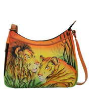 Anna by Anuschka style 8241, handpainted Cross Body Hobo. Lion In Love painting in yellow color. Featuring two vertical zippered pocket at gusset, Fits E-Reader, Fits tablet, Fits Laptop.