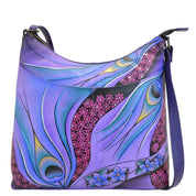 Anna by Anuschka style 8251, handpainted Large Organizer Cross Body. Dreamy Peacock Dewberry painting in purple color. Featuring inside open wall pocket, full length zippered wall pocket, two multipurpose pockets. four credit card Holders, three penholders with 10" notebook compartment.