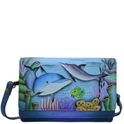 Anna by Anuschka style 8262, handpainted Flap Organizer Cross Body. Playful Dolphin painting in blue color. Featuring ten credit card holders, two ID window, one zippered pocket, Removable strap, Fits phone, Built-in organizer.