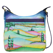 Anna by Anuschka style 8268, handpainted Medium Cross Body. Timeless Tuscany painting in blue color. Featuring inside zippered wall pocket, open wall pocket. Two multipurpose pockets, Fits E-Reader, Fits tablet.