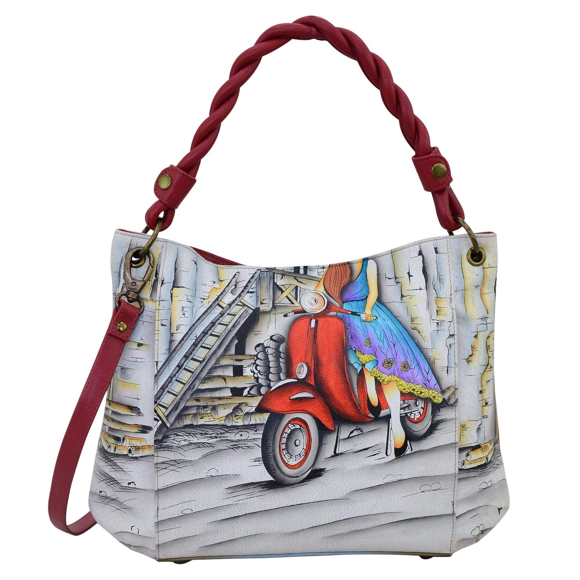 Anna by Anuschka style 8274, handpainted Slim Shoulder Bag. Roman Dreams painting in white color. Featuring inside one full length zippered wall pocket, one open wall pocket, two multipurpose pockets and two vertical zippered pockets.