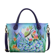 Anna by Anuschka style 8293, handpainted Slouch Tote. Midnight Peacock painting in blue color. Featuring fop zip entry to main compartment Inside one zippered wall pocket, Fits E-Reader, Fits tablet.