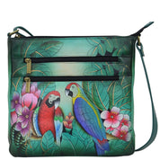 Anna by Anuschka style 8296, handpainted Medium Organizer Crossbody. Brazilian Beauties painting in green/mint color. Featuring inside zippered wall pocket, one open wall pocket and two multipurpose pockets, Fits E-Reader, Fits tablet, Built-in organizer, Hands-free.
