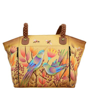 Anna by Anuschka style 8315, handpainted East-West Organizer Tote. Sienna Sunset painting in tan color. Featuring front zippered organizer chamber with eight cc holder, Built-in organizer, Fits Laptop, Fits tablet, Fits E-Reader.