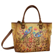 Anna by Anuschka style 8332, handpainted Large Tote. Sienna Sunset painting in tan color. Featuring double magnetic snap button entry to main compartment, inside zippered wall pocket, one open wall pocket, two multipurpose pockets, rear full length zippered pocket and slip in cell pocket.