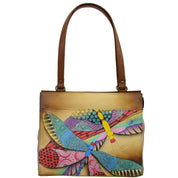 Anna by Anuschka style 8360, handpainted Medium Shoulder Bag. Dancing Dragonflies painting in tan color. Featuring four multipurpose slip in pockets and three card holders and pen holders.