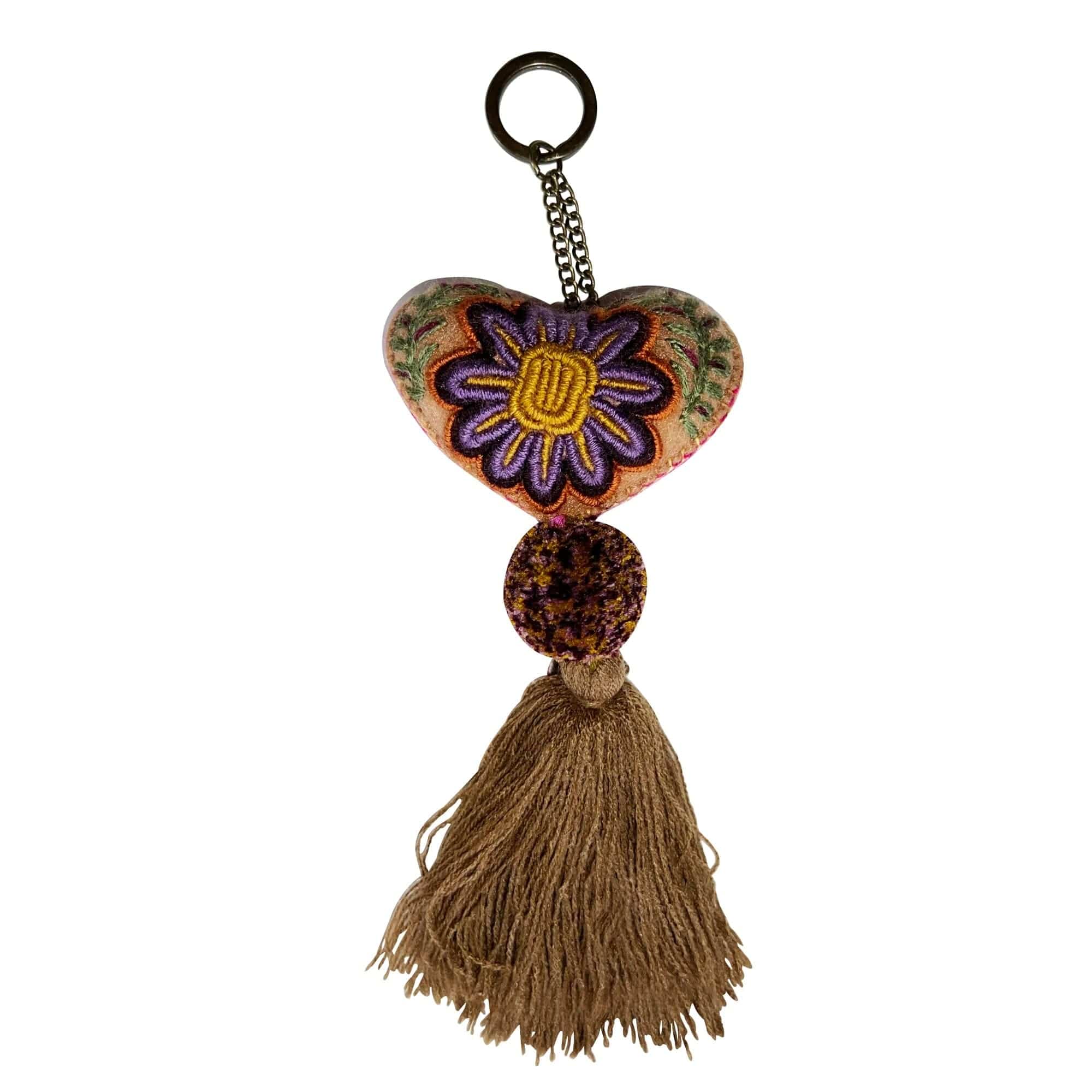 Anuschka style 12007, Hand Woven Charms from Oaxaca, Mexico. The handmade felt heart Keycharms have a beautiful embroidered floral design adorned with pompoms and tassels, from Oaxaca, Mexico.
