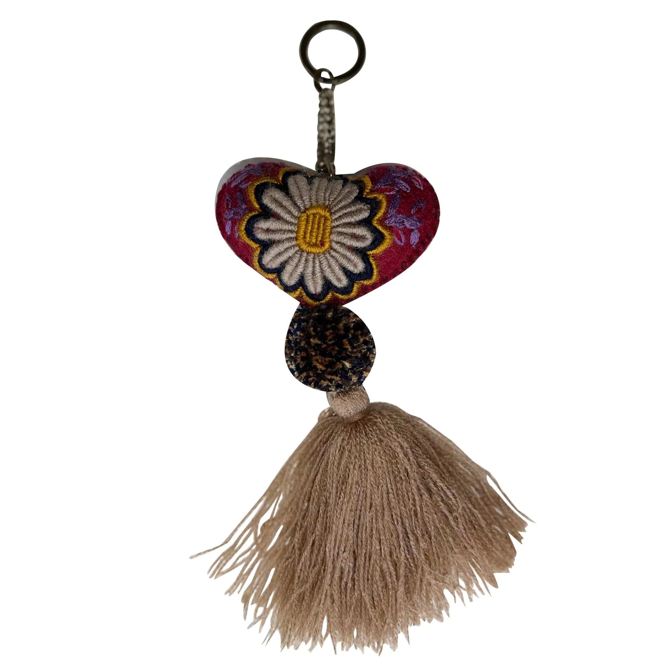 Anuschka style 12007, Hand Woven Charms from Oaxaca, Mexico. The handmade felt heart Keycharms have a beautiful embroidered floral design adorned with pompoms and tassels, from Oaxaca, Mexico.
