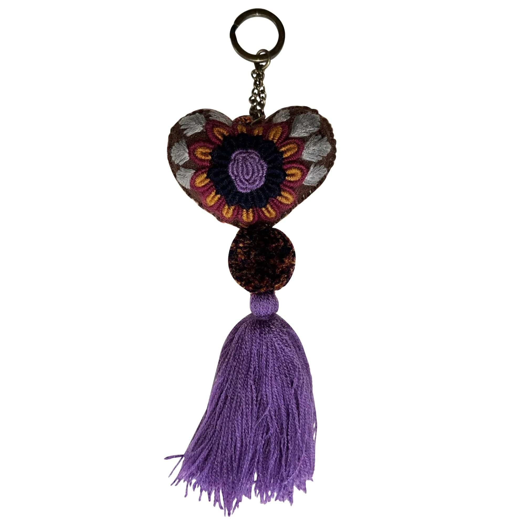 Anuschka style 12007, Hand Woven Charms from Oaxaca, Mexico. The handmade felt heart Keycharms have a beautiful embroidered floral design adorned with pompoms and tassels, from Oaxaca, Mexico.