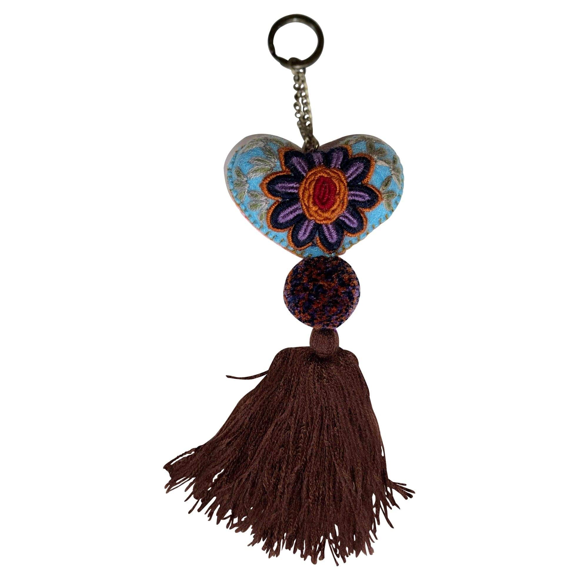 Anuschka style 12007, Hand Woven Charms from Oaxaca, Mexico. The handmade felt heart Keycharms have a beautiful embroidered floral design adorned with pompoms and tassels, from Oaxaca, Mexico.