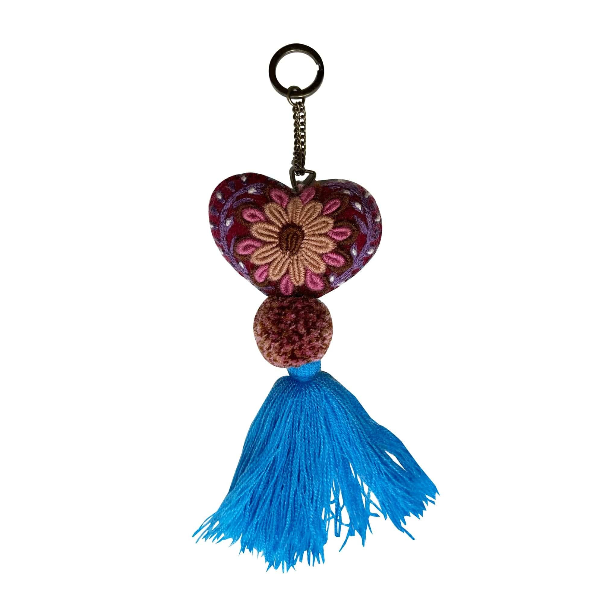 Anuschka style 12007, Hand Woven Charms from Oaxaca, Mexico. The handmade felt heart Keycharms have a beautiful embroidered floral design adorned with pompoms and tassels, from Oaxaca, Mexico.