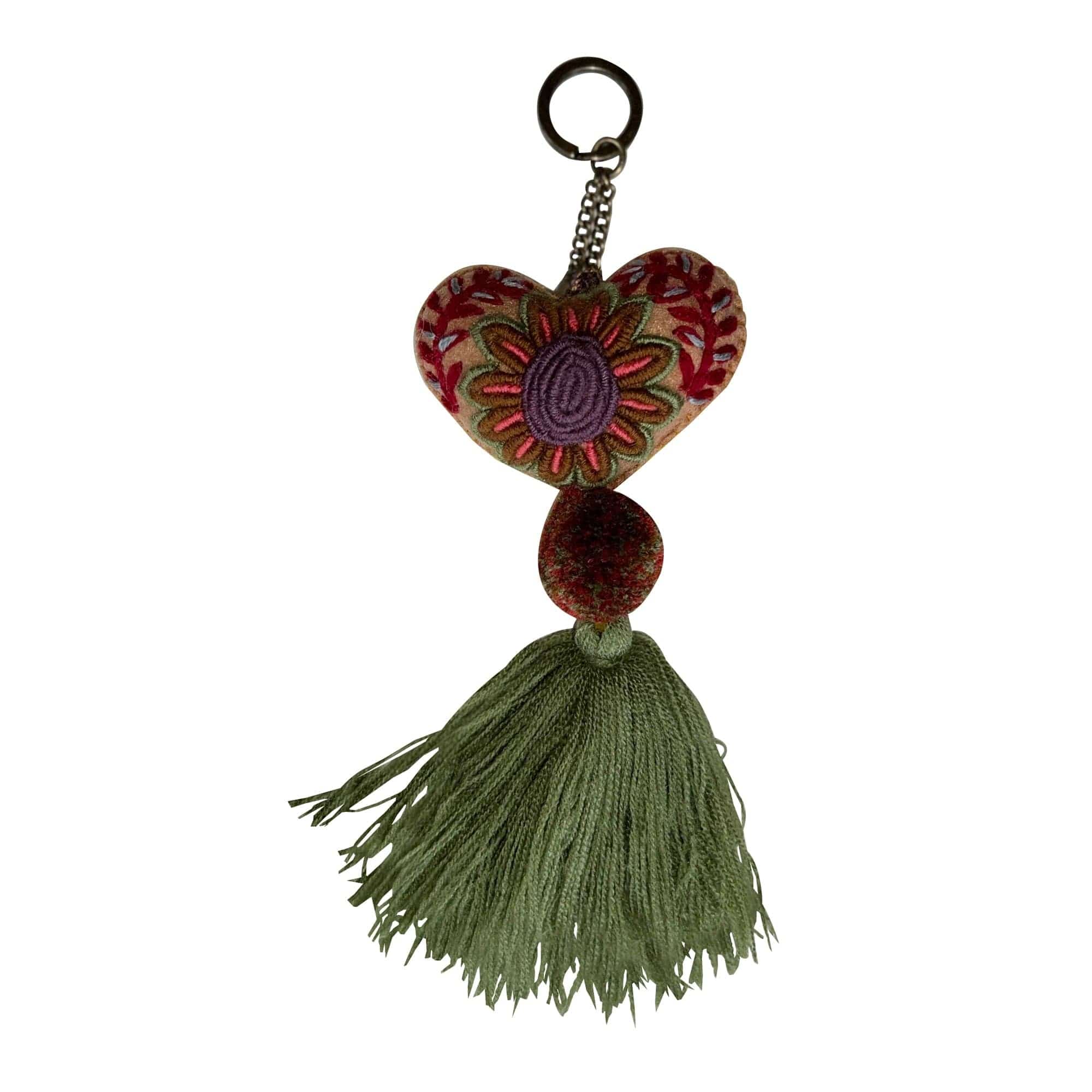 Anuschka style 12007, Hand Woven Charms from Oaxaca, Mexico. The handmade felt heart Keycharms have a beautiful embroidered floral design adorned with pompoms and tassels, from Oaxaca, Mexico.