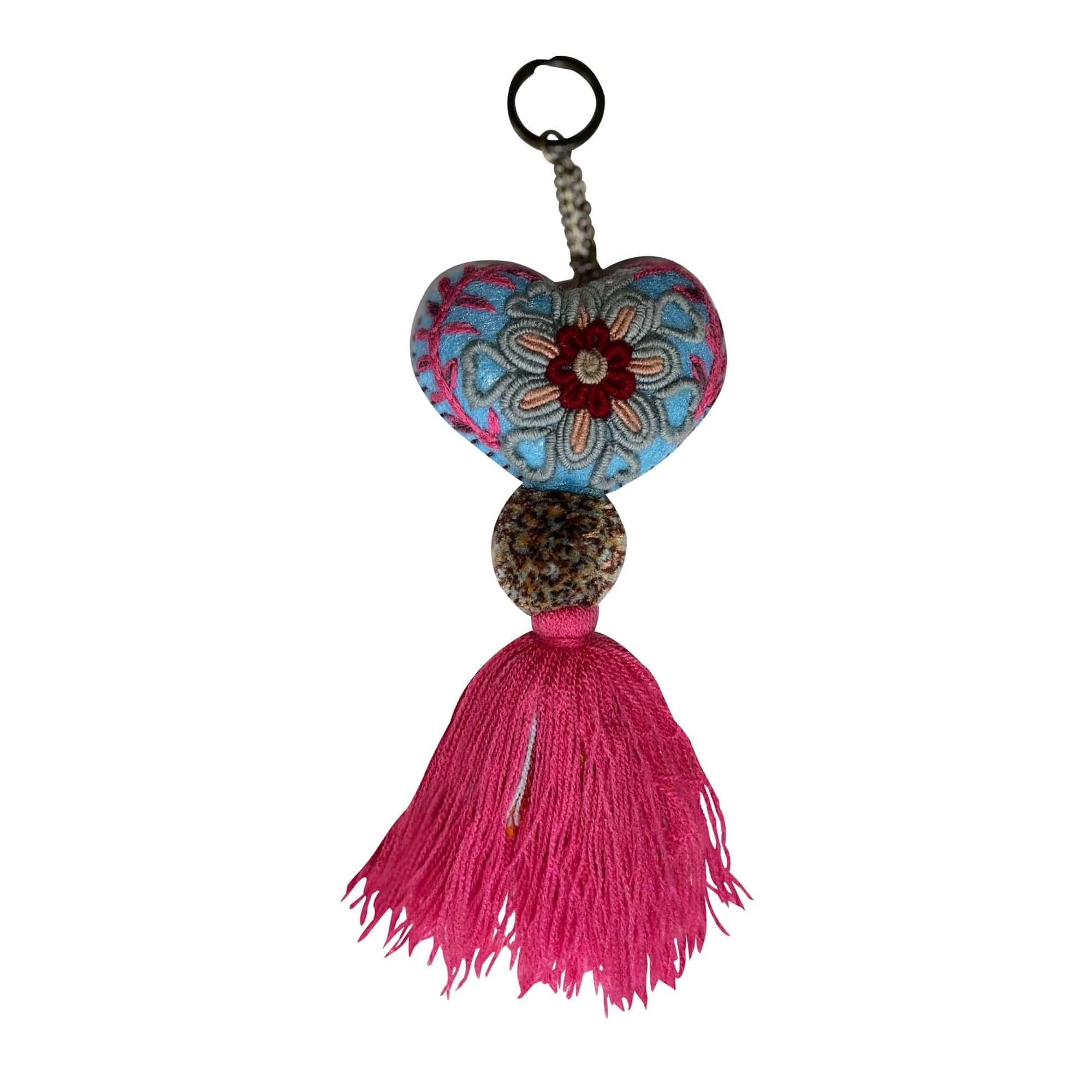 Anuschka style 12007, Hand Woven Charms from Oaxaca, Mexico. The handmade felt heart Keycharms have a beautiful embroidered floral design adorned with pompoms and tassels, from Oaxaca, Mexico.