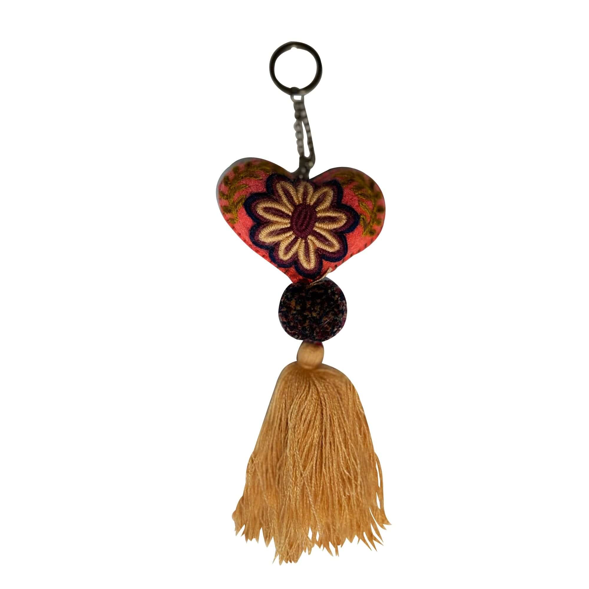 Anuschka style 12007, Hand Woven Charms from Oaxaca, Mexico. The handmade felt heart Keycharms have a beautiful embroidered floral design adorned with pompoms and tassels, from Oaxaca, Mexico.