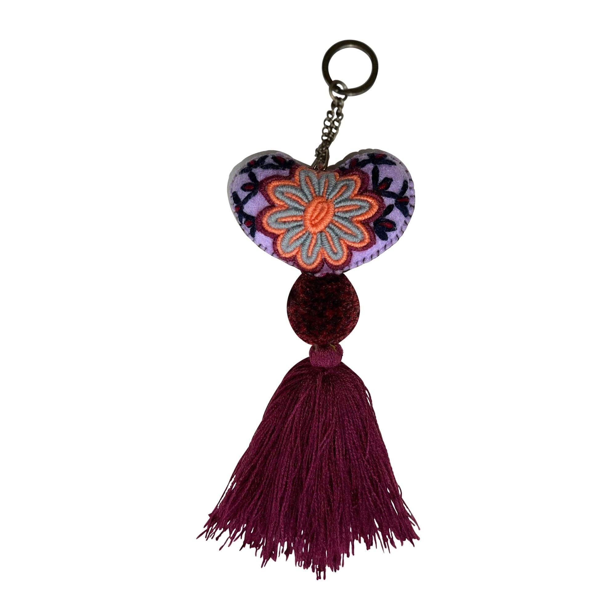Anuschka style 12007, Hand Woven Charms from Oaxaca, Mexico. The handmade felt heart Keycharms have a beautiful embroidered floral design adorned with pompoms and tassels, from Oaxaca, Mexico.