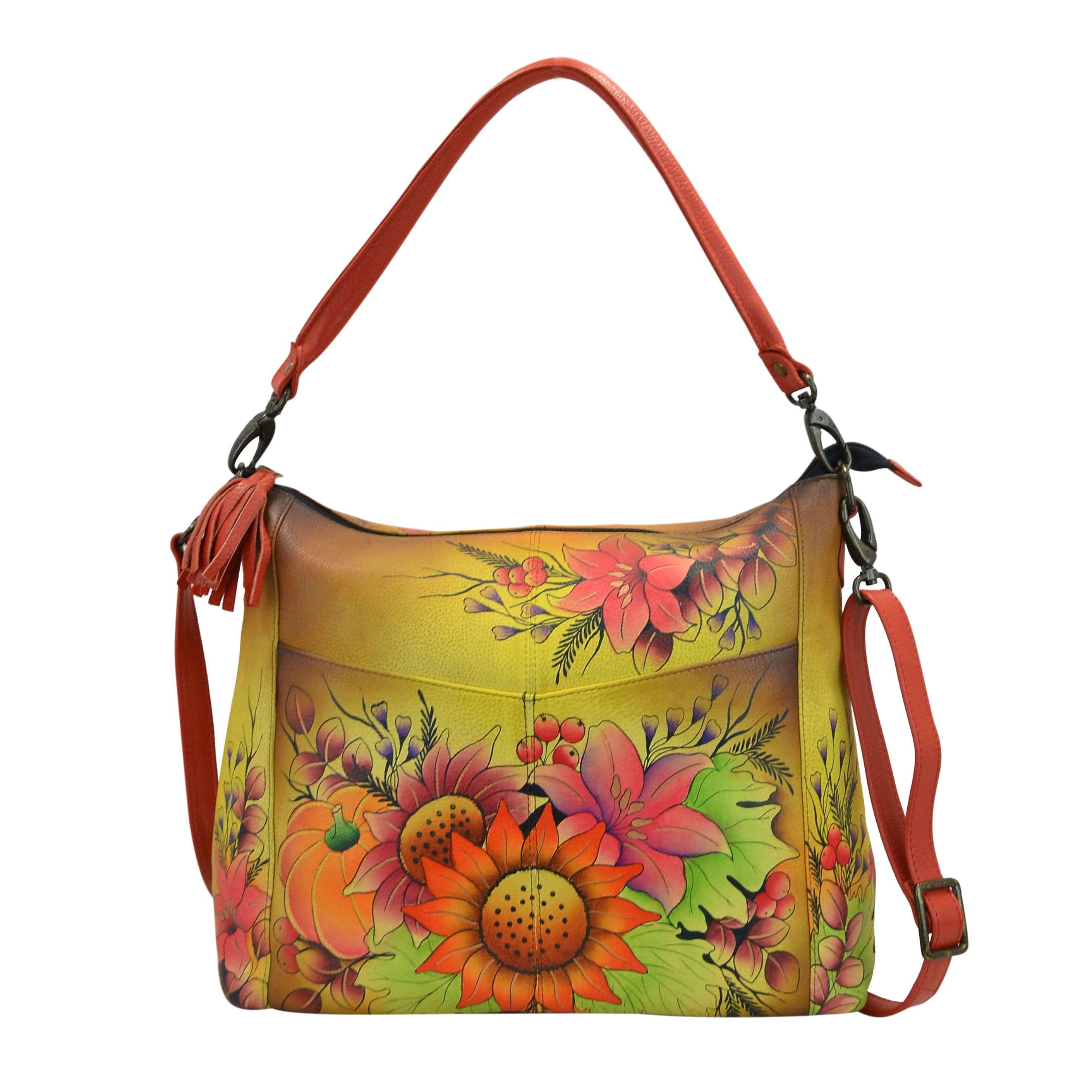 Anna by Anuschka style 8188, handpainted Convertible Shoulder Bag. Fall Bouquet painting in orange color. Featuring inside one zippered wall pocket, one open wall pocket, two multipurpose pockets, Fits tablet, Fits E-Reader, Fits Laptop, Removable strap.