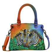 Anna by Anuschka style 8252, handpainted Small Satchel. Zebra Safari painting in multi color. Featuring inside one zippered wall pocket, two multipurpose pockets, Fits E-Reader, Fits tablet, Removable strap.