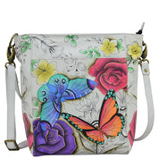 Anna by Anuschka style 8365, handpainted Large Hobo. Floral Paradise painting in white color. Featuring inside one full length zippered wall pocket, one open wall pocket two multipurpose pockets.